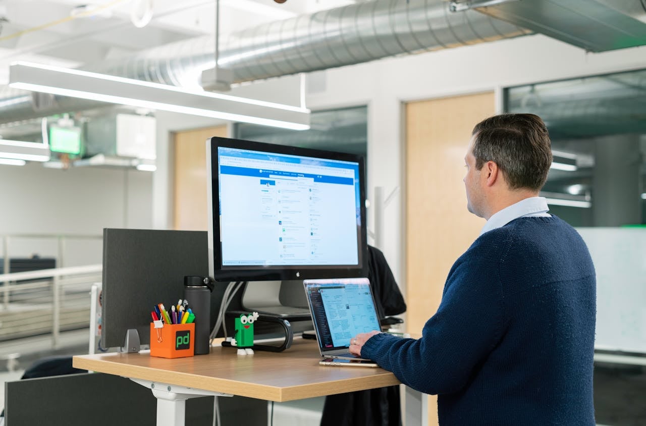 man looking at a screen with linkedin