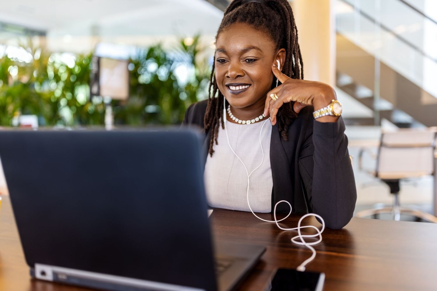 ai LinkedIn Headshot woman working laptop